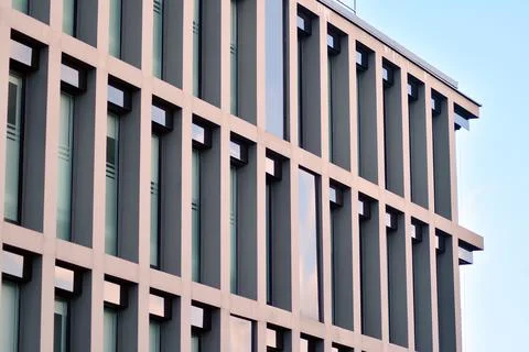 A view at a straight facade of a modern building Stock Photos