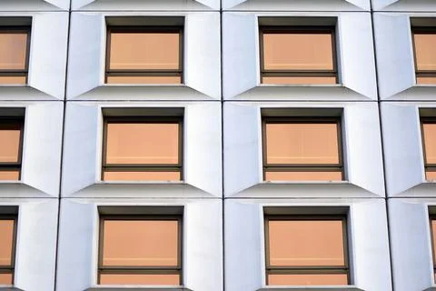 A view at a straight facade of a modern building Stock Photos