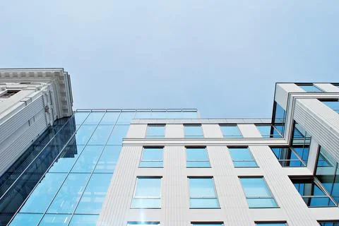 A view at a straight facade of a modern building Stock Photos