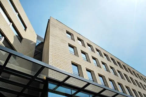 A view at a straight facade of a modern building Stock Photos