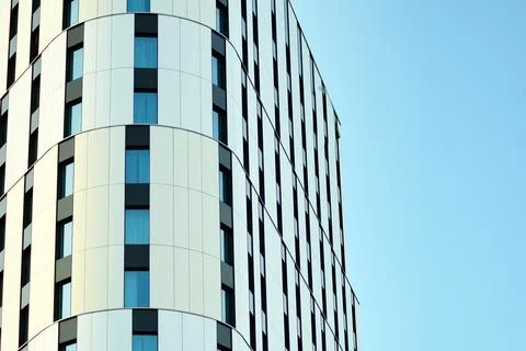 A view at a straight facade of a modern building Stock Photos