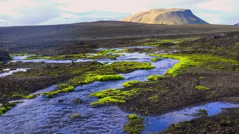 View of the stream flowing at the beautiful mountain with the mossy rocks Stock Footage 95379856