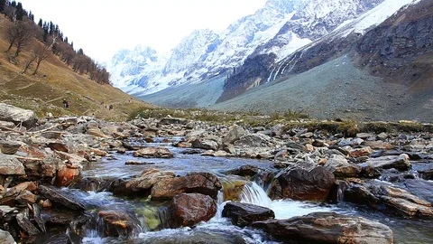 View of a stream with the great Himalayan Glacier of Kashmir Valley Stock Footage 83621732