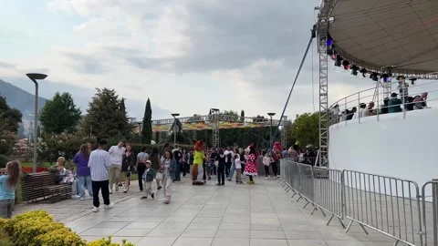 View of street fair. Crowd. Animators dressed as cartoon characters Stock Footage 252407603