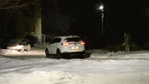 View street in the late evening during snowfall Stock Footage 129577754