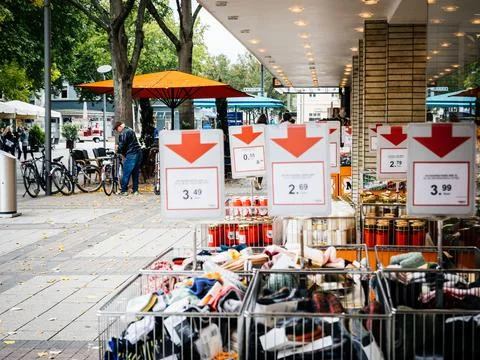 View from the street of multiple objects from sale in front of Muller store Stock Photos