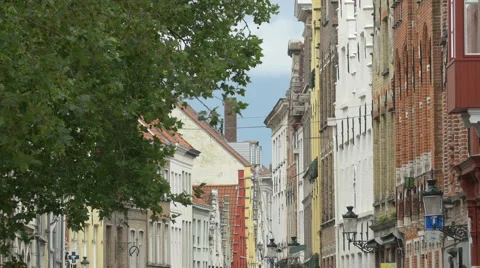 View of a street with old colorful buildings and lanterns in Bruges Stock Footage 59657004