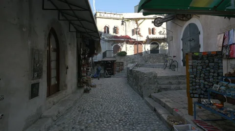 View of a street with stores and beautiful building in Mostar Stock Footage 59172620