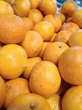 View of a stretch of fresh oranges Stock Photos