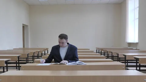 View Of Student Is Working At Desk In Classroom Stock Footage 287993012