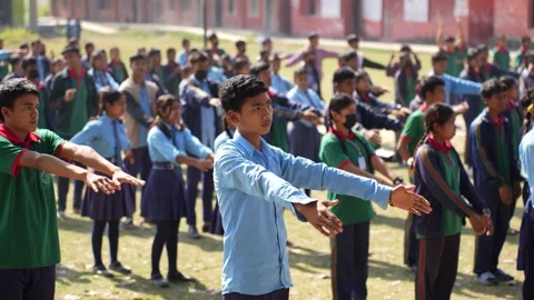 View of students performing morning exercises in Dhangadhi, Nepal. Video stock 335477049