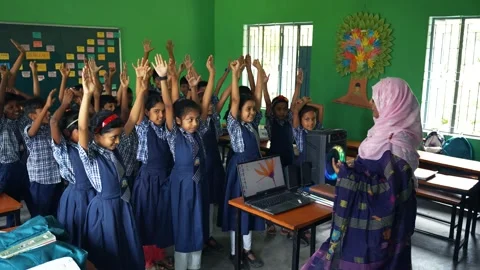 View of students with raised hands in a classroom, Bangladesh. Stock Footage 335584902