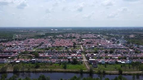 View of subsidized and commercial housing in Banjarmasin which is dense and.. Stock Footage 283889849
