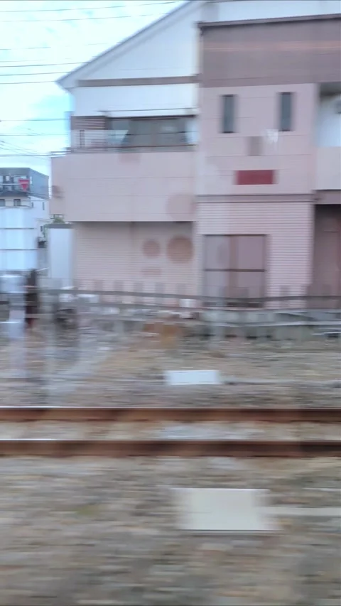 View of a suburban area from the window of the Shinkansen Bullet Train Stock Footage 280865551