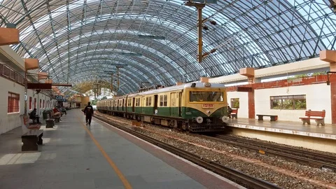 View of suburban train arriving at local railway station in Chennai. Stock Footage 128191545