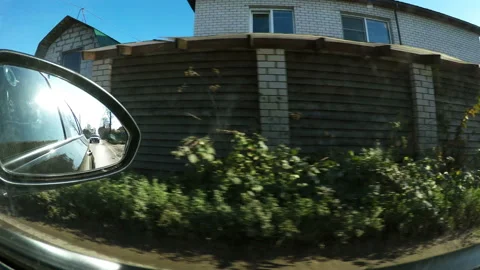 The view of the suburbs from the passenger seat window of the car Stock Footage 106672962