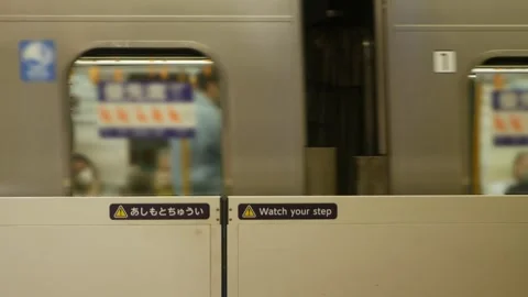 View at subway platform station with safety gate for boarding the train com.. Stock Footage 313036560
