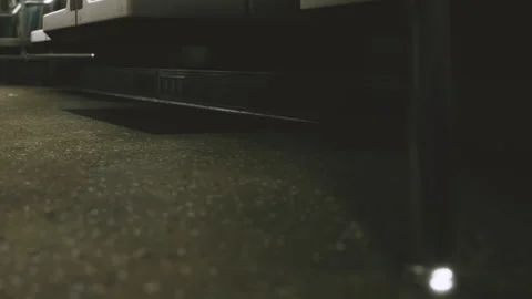 View of a subway train floor with empty seats and dark walls during trip Stock Footage 340227439