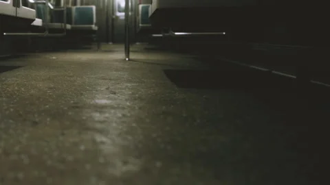View of subway train floor showing empty seats and dim lighting Stock Footage 339493543