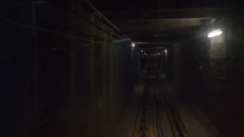 View of a subway tunnel as seen from the front of a moving train Stockbeeldmateriaal 81545275