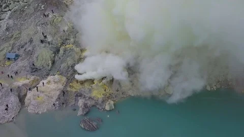 View of sulphur mining mountain volcano crater with acidic lake Ijen. Stock Footage 101905717