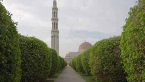 View of the Sultan Qaboos Grand Mosque from green alley Stock Footage 99268436