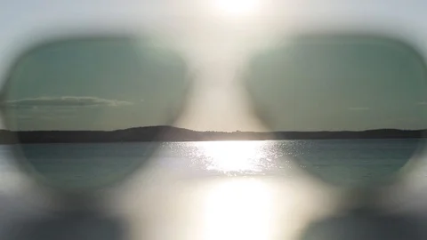 View of summer sea beach water though sunglasses closeup. Seascape through glass Stock Footage 87024680