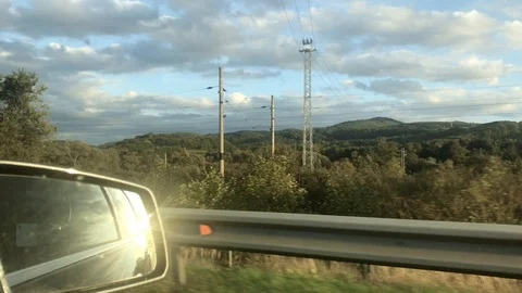 View on sun reflection in side mirror from vehicle on motorway Stock Footage 118339342