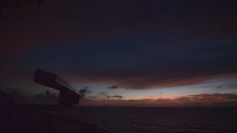 View of the sun setting from the front of a cruise ship Stock Footage 291331530