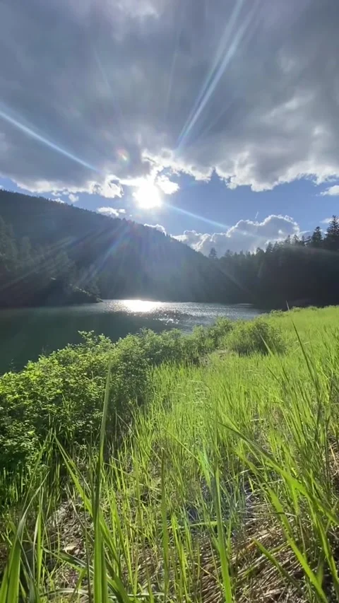 The view of the sun shining over the hills of the mountains 動画素材 244088871