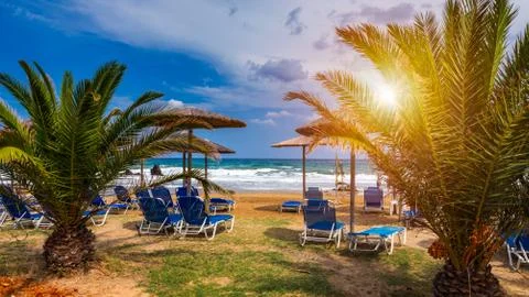 View of sunbeds awaiting tourists at the Greek island resort of Georgioupolis Stock Photos