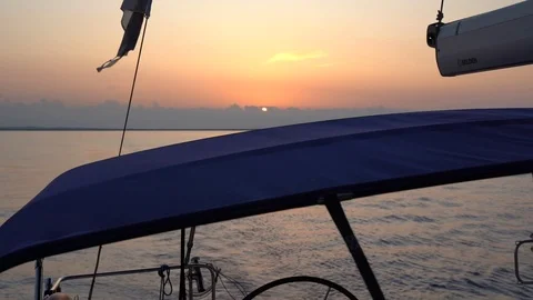 View on a sunset from the aft of a sailing boat Stock Footage 120257989