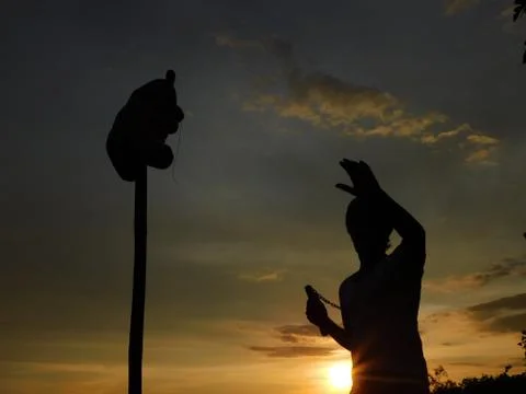 View of sunset and a man doing martial arts Stock Photos