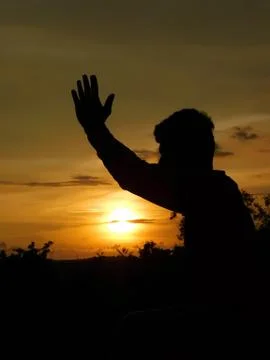 View of sunset and shadow of a man doing yoga Stock Photos