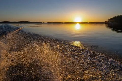 View of the sunset and the shore of The Lake Saimaa in the evening Stock Photos