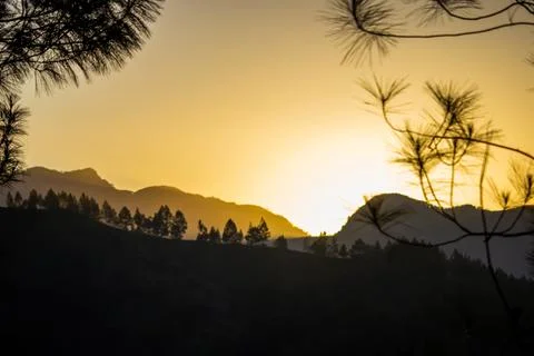 The view of the sunset behind the mountain, so beautiful Stock Photos