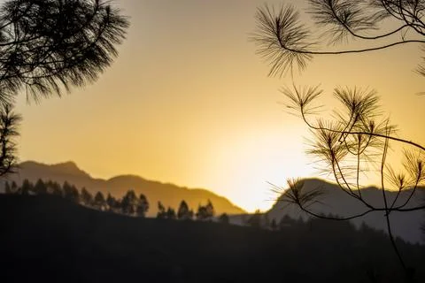 The view of the sunset behind the mountain, so beautiful Stock Photos