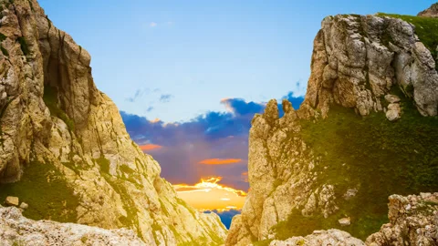 View to a sunset from a crack in the mountain Video stock 257606321