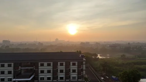 View of the sunset on the edge of town Stock Footage 260698818