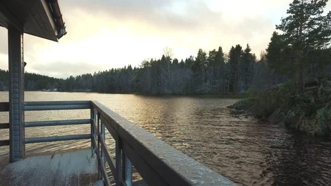 View of the sunset from the house on the lake Stock Footage 89690957