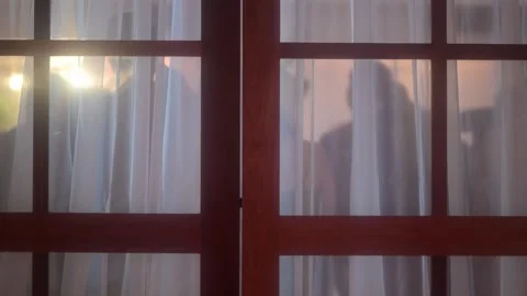 View of sunset light through window curtains, Brazil. Stock Footage 335763066