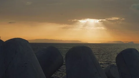 View of sunset on Madeira when sun beams go through whole in clouds in sky Stock-Footage 92815177