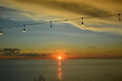 View of the sunset with the orange clouds and blue sky Stock Photos