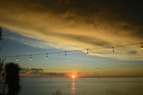 View of the sunset with the orange clouds and blue sky Stock Photos