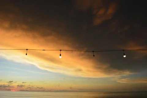 View of the sunset with the orange clouds and blue sky Stock Photos