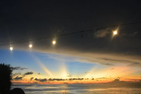 View of the sunset with the orange clouds and blue sky Stock Photos