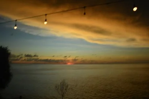 View of the sunset with the orange clouds and blue sky Stock Photos