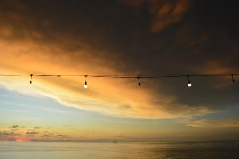 View of the sunset with the orange clouds and blue sky Stock Photos