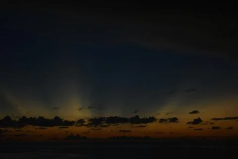 View of the sunset with the orange clouds and blue sky Stock Photos