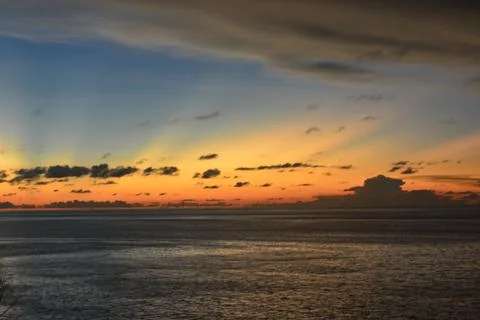 View of the sunset with the orange clouds and blue sky Stock Photos